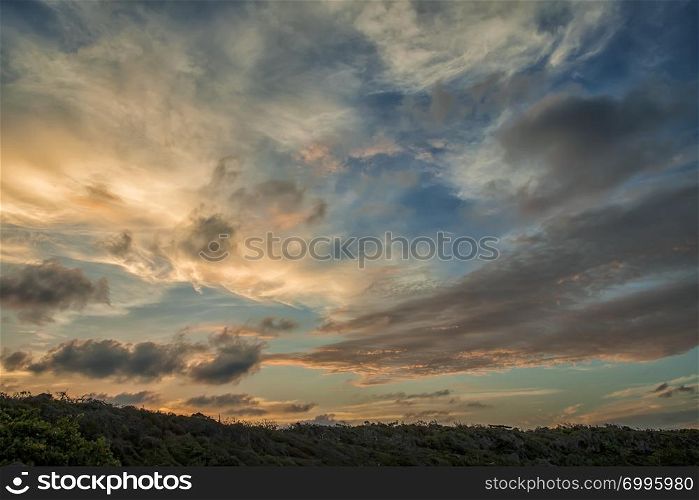Amazing colorful clouds after sunset. Amazing view on the dramatic sunset sky.