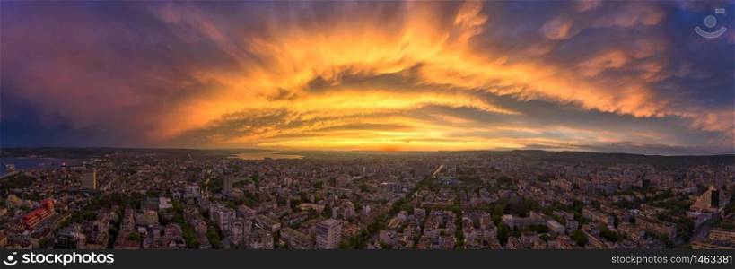 Amazing colorful clouds over the city. Aerial panorama from a drone. Varna, Bulgaria