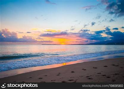 Amazing colorful sunset on the beach. Idyllic perfect turquoise water at exotic island