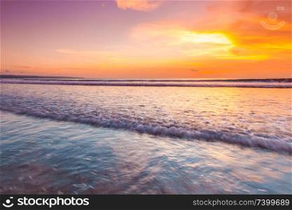 Amazing colorful sunset over sea form Bali beach and majestic cloudscape. Sunset over the sea