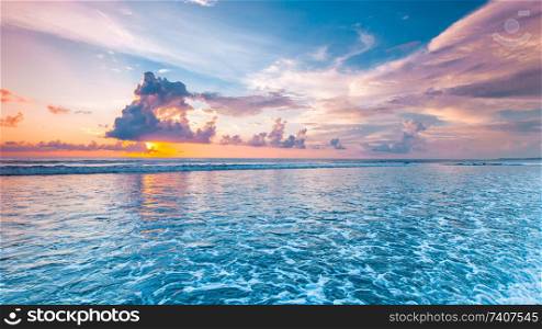 Amazing colorful sunset over sea form Bali beach and majestic cloudscape. Sunset over the sea