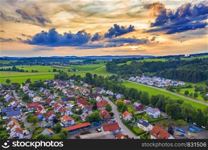 Amazing colorful sunset over the small village in Germany