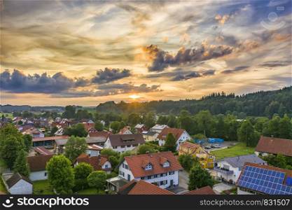 Amazing colorful sunset over the small village in Germany