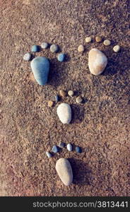 Amazing concept from stone, group of pebble as family illustration, foot step on rock, funny toe, pretty idea for design