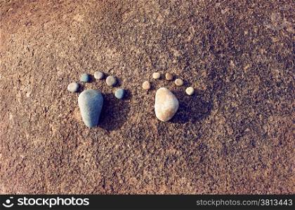 Amazing concept from stone, group of pebble as family illustration, foot step on rock, funny toe, pretty idea for design