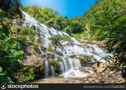 Amazing deep forest big waterfall at Mae Ya waterfall, Doi Inthanon national park Chiangmai, Thailand. Translate text