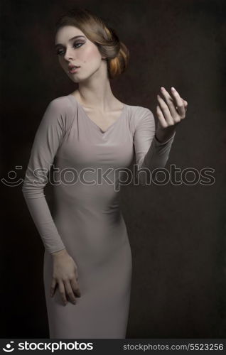 amazing fashion portrait of cute young lady with elegant look, gray dress and perfect body