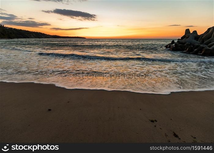 Amazing flow sea wave, wide-angle view, a beautiful view with first rays over the sea.