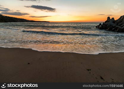 Amazing flow sea wave, wide-angle view, a beautiful view with first rays over the sea.