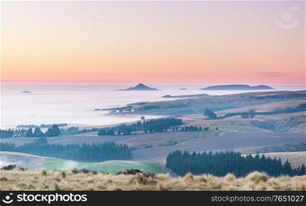 Amazing foggy rural landscapes at morning. New Zealand beautiful nature