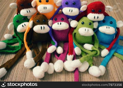 Amazing handmade product, group of colorful homemade monkey with funny humorous , knitted monkeys, knit from wool, woolen toy to happy new year, fun animal