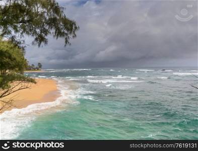 Amazing hawaiian beach. Wave in ocean at sunset or sunrise with surfer. Wave with warm sunset colors.