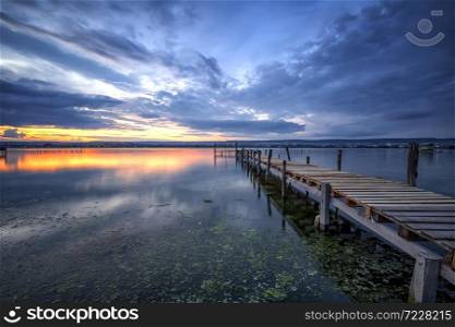 amazing long exposure sea sunset at the wooden jetty