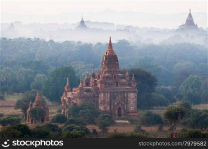 Amazing misty sunrise over ancient Buddhist Temples at Bagan Kingdom. Myanmar (Burma) travel destinations