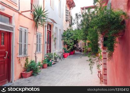 Amazing narrow streets of popular destination on Crete island. Sunny morning in Greece. Traditional architecture and colors of mediterranean city. Place for romantic vacation and summer travel