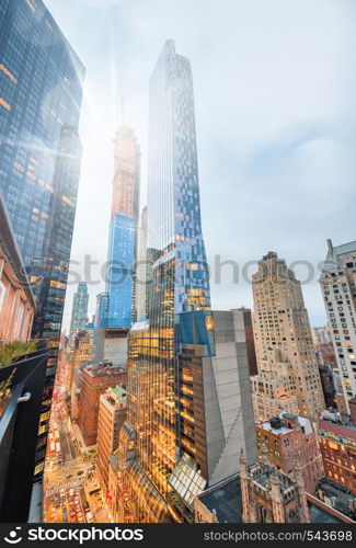 Amazing night skyline of City Downtown. Wide angle portrait view of aerial skyline from rooftop. Business and corporate concept