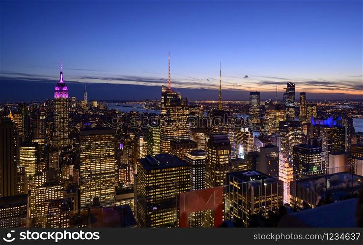 Amazing panorama view of New York city skyline and skyscraper at sunset.
