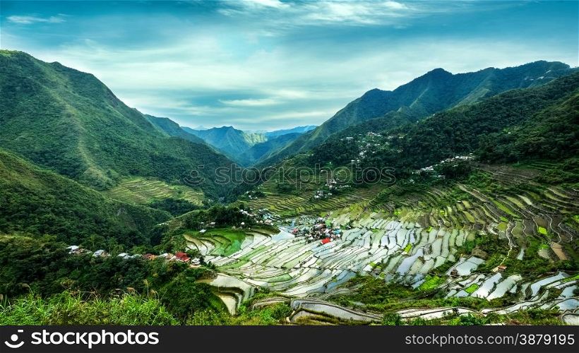 Amazing panorama view of rice terraces fields in Ifugao province mountains under cloudy blue sky. Banaue, Philippines UNESCO heritage