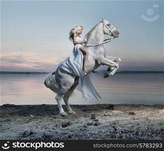 Amazing portrait of blond lady on the horse