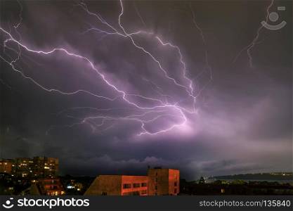Amazing powerful lightning strikes over the sea and city, Varna. Bulgaria