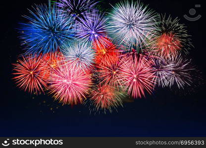 Amazing red, golden, blue fireworks over night sky. Amazing red, golden, blue fireworks. Celebration beautiful colorful fireworks. Holidays salute of various colors on night sky. 4 of July. 4th of July. Independence Day. New Year. Beautiful fireworks.