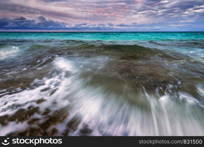 Amazing scenic seascape with motion blur and flowing waves.