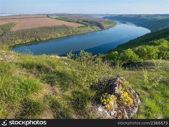 Amazing spring view on the Dnister River Canyon with picturesque rocks, fields, flowers. This place named Shyshkovi Gorby, Nahoriany, Chernivtsi region, Ukraine.