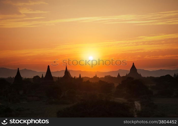 Amazing sunset colors and silhouettes of ancient Buddhist Temples at Bagan Kingdom, Myanmar (Burma). Travel landscape and destinations