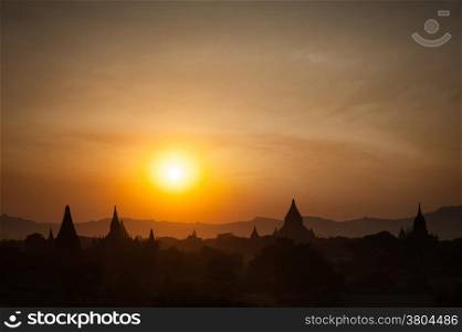 Amazing sunset colors and silhouettes of ancient Buddhist Temples at Bagan Kingdom, Myanmar (Burma). Travel landscape and destinations