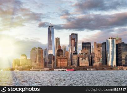 Amazing sunset skyline of Lowr Manhattan from a cruise ship, New York City