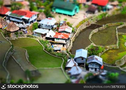 Amazing tilt shift effect view of rice terraces fields and village houses in Ifugao province mountains. Banaue, Philippines UNESCO heritage