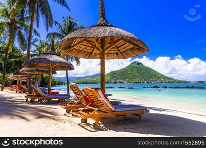 Amazing tropical scenery of beautiful beach and mountain view. Flic en Flac, Mauritius island. Flic en Flac, Mauritius island