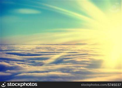 Amazing view from plane on the sky, sunset sun and clouds