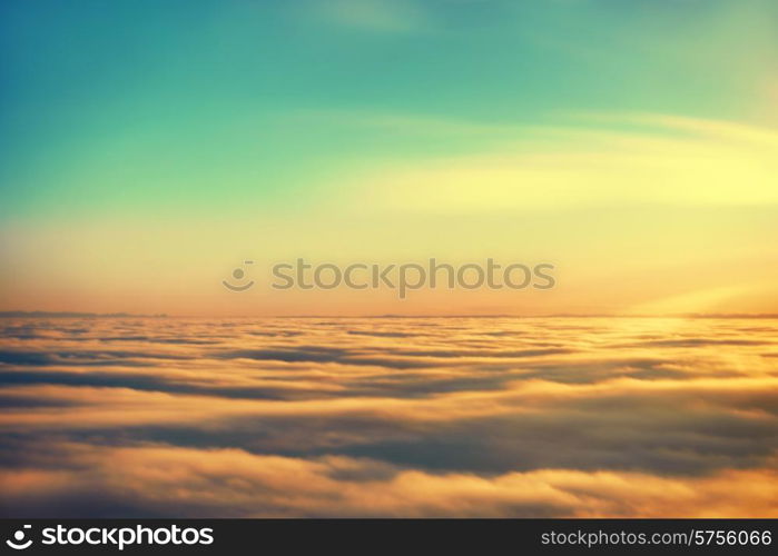 Amazing view from plane on the sky, sunset sun and clouds