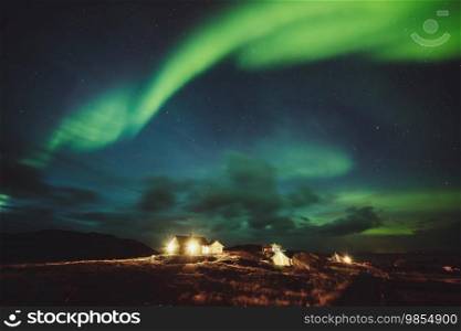 Amazing view of a beautiful aurora borealis dancing in the sky. Majestic northern light at night. Travel to Norway. The beauty of wild nature.. Amazing view of Aurora Borealis
