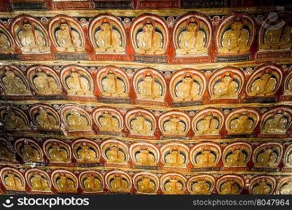 Amazing view of religious carving on limestone rock in sacred Golden Temple. Dambulla, Sri Lanka travel destinations