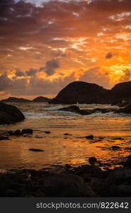 Amazing view sunset over the nordic rocks on the most southern point of Norway in Lindesnes, South Cape, Vest-Agder, Norway. Coastline at sunset in Norway