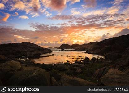 Amazing view sunset over the nordic rocks on the most southern point of Norway in Lindesnes, South Cape, Vest-Agder, Norway. Coastline at sunset in Norway