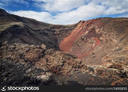 Amazing volcanic landscape. Volcanic crater in Timanfaya national park, Lanzarote, canary islands, Spain.