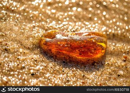 Amber on a beach of the Baltic Sea in the surf. Amber on a beach of the Baltic Sea in the surf