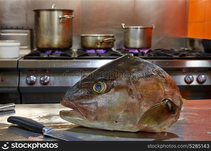 Amberjack fish head fillet process in stainless steel kitchen