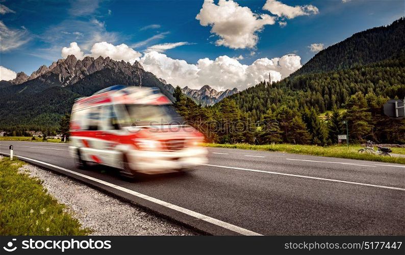 Ambulance van rushes down the highway