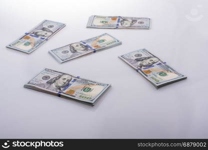 American 100 dollar banknote bundles placed on white background