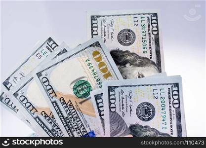 American 100 dollar banknotes made of paper placed on white background