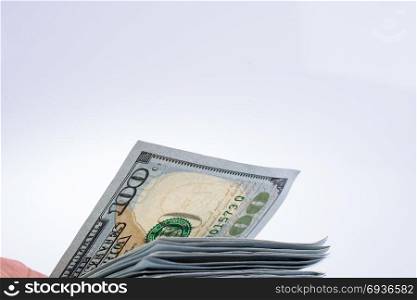 American 100 dollar banknotes made of paper placed on white background