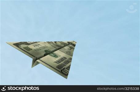 American bank note in the shape of an airplane flying in the sky