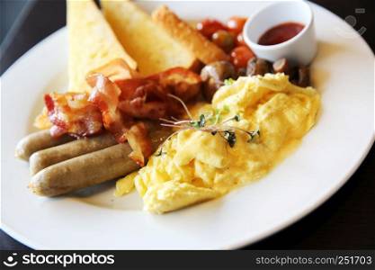 American Breakfast with bacon , scrambled egg on wood background