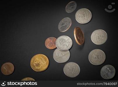American coin falling on black background