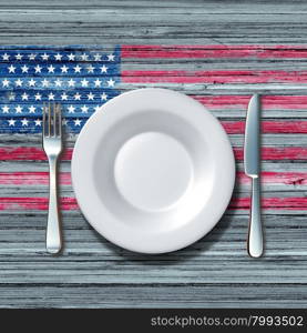 American cuisine food concept as a place setting with knife and fork on an old rustick wood table with a symbol of the flag of the united states as an icon of traditional family eating in america.&#xA;&#xA;