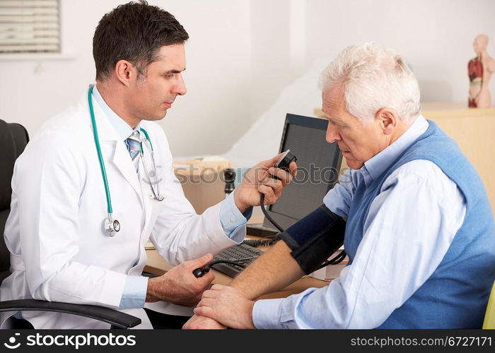 American doctor taking senior man&acute;s blood pressure